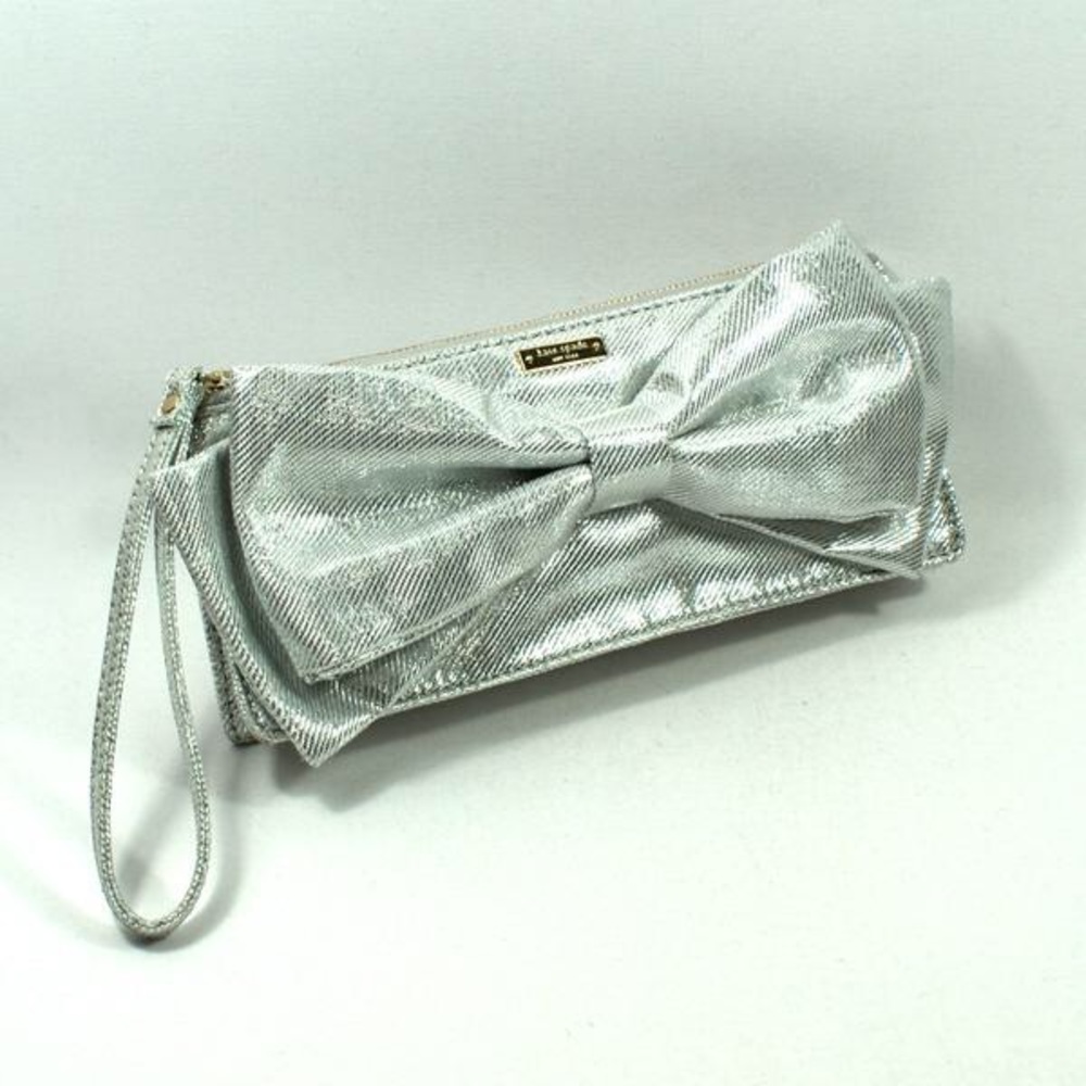 Silver Kate Spade wristlet clutch with bow